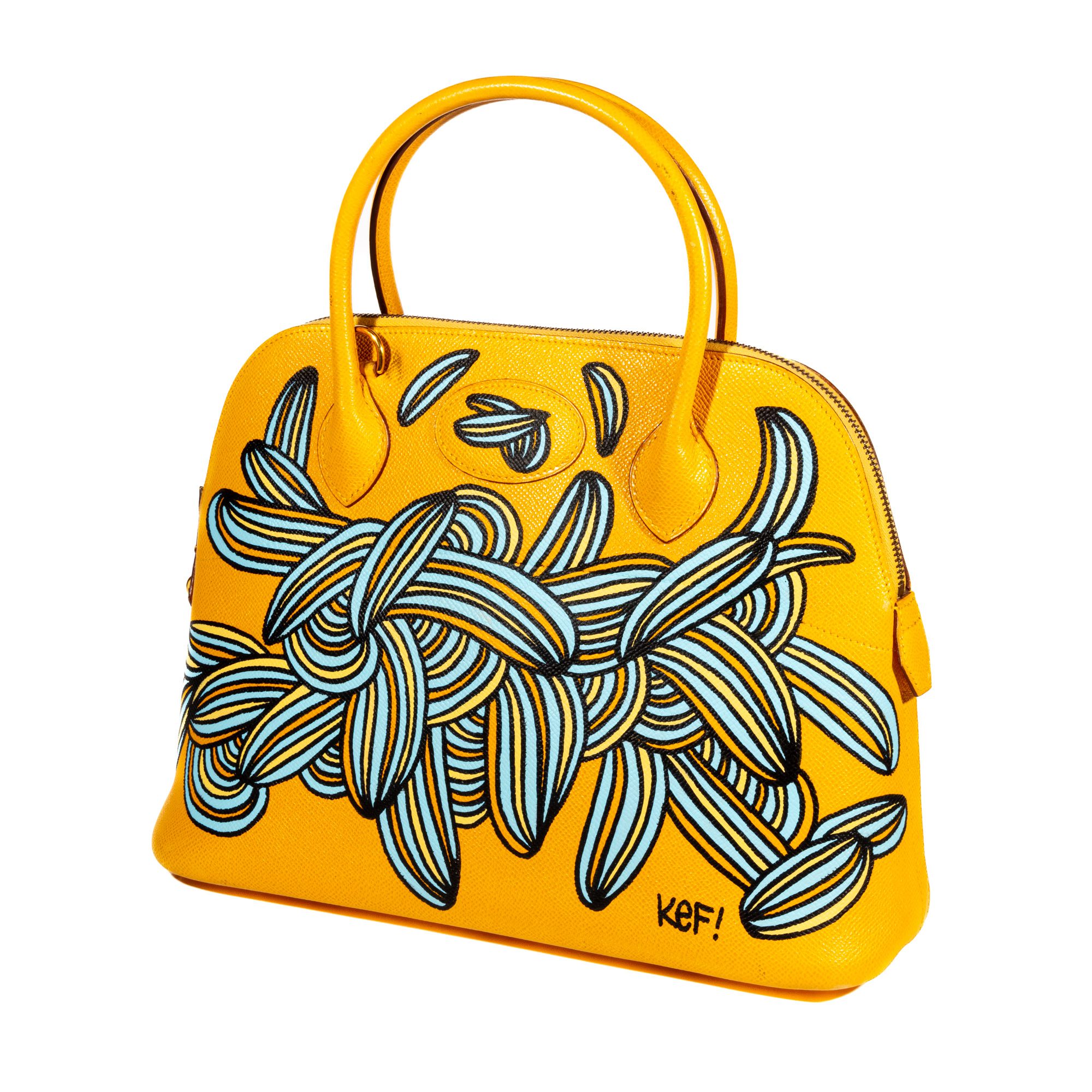 KEF! (GERMAN, B. 1989) HERMES BOLIDE BAG MULTICOLOR ON YELLOW Description: A striking hand-painted Hermes Bolide bag, transformed by KEF!’s vibrant multicolor design on a yellow background. This piece exemplifies KEF!’s unique style, blending modern art with luxury fashion. The bag is signed by the artist along the lower edge. Details: Medium: Hand-painted Hermes Bolide Bag Dimensions: 340 x 345 mm Signature: Signed by the artist along the lower edge Painted: 2024