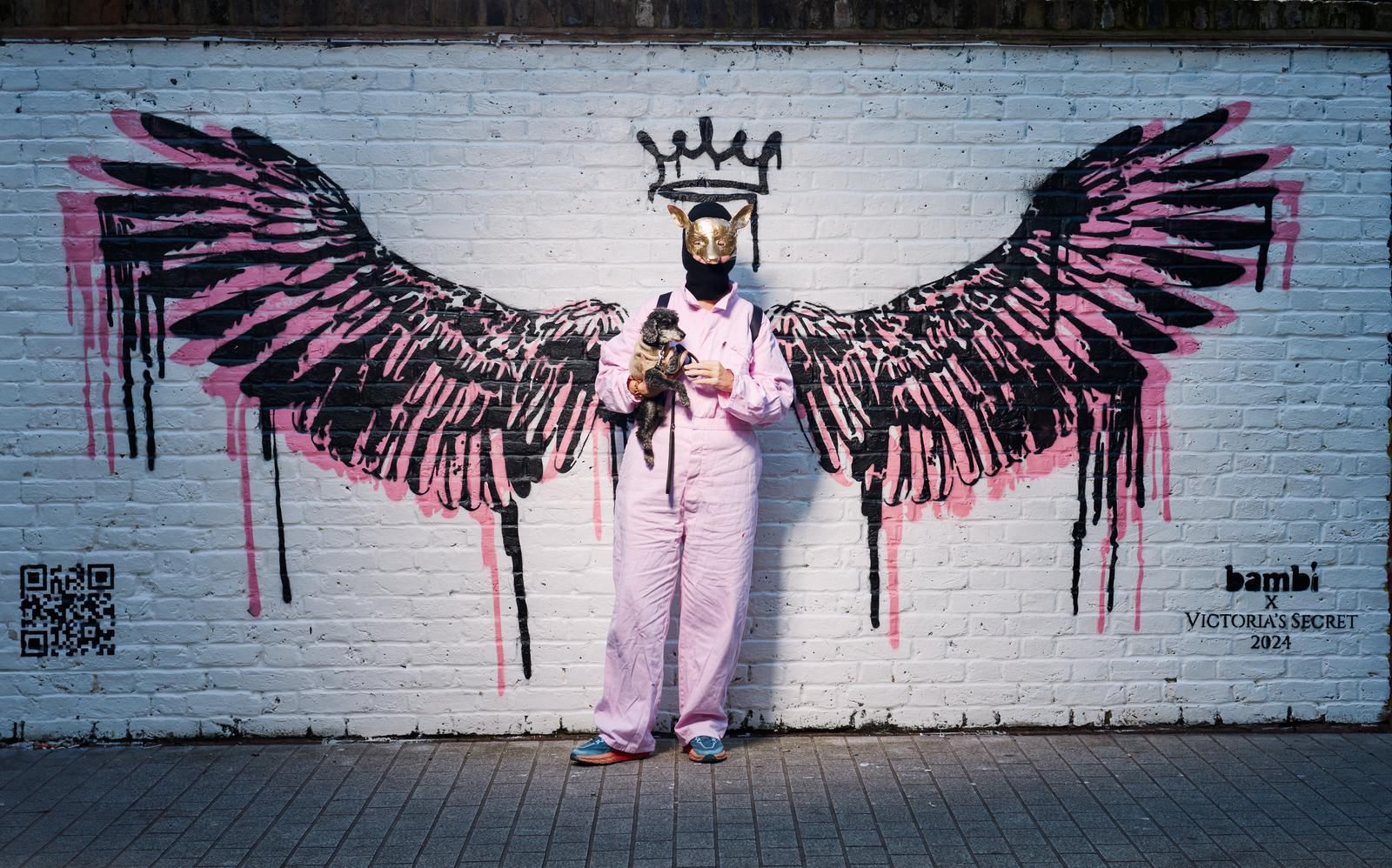 picture of famous street artists bambi first ever she is positioned against her art of wings for victoria secrets 2024